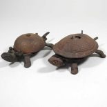 Two metal tortoise bells