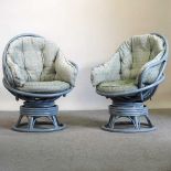 A pair of revolving egg chairs