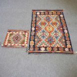 A kelim rug and another