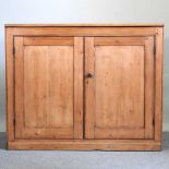 An antique pine cabinet