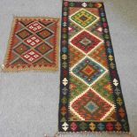 A kelim runner and a rug