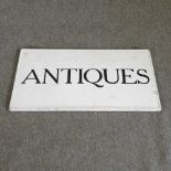 A vintage 'Antiques’ sign