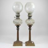 A pair of peg oil lamps