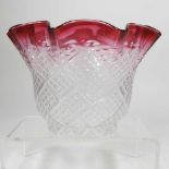 A pink glass oil lamp shade