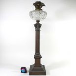 A brass column oil lamp