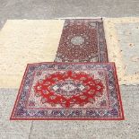 A collection of four rugs