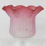 A pink oil lamp shade