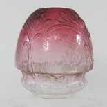 A pink oil lamp shade