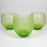Three green glass lamp shades