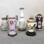 A collection of oil lamp bases