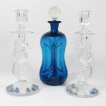 A pair of candlesticks and a decanter