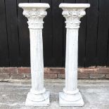 A pair of cast stone columns