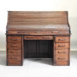 An oak roll top desk
