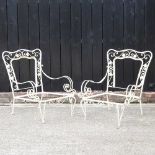 A pair of metal armchair frames
