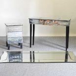 A table, mirror and cabinet