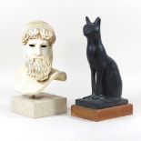 A bust and a cat