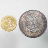 A sovereign and a dollar coin