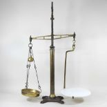 A balance scale and leather bag