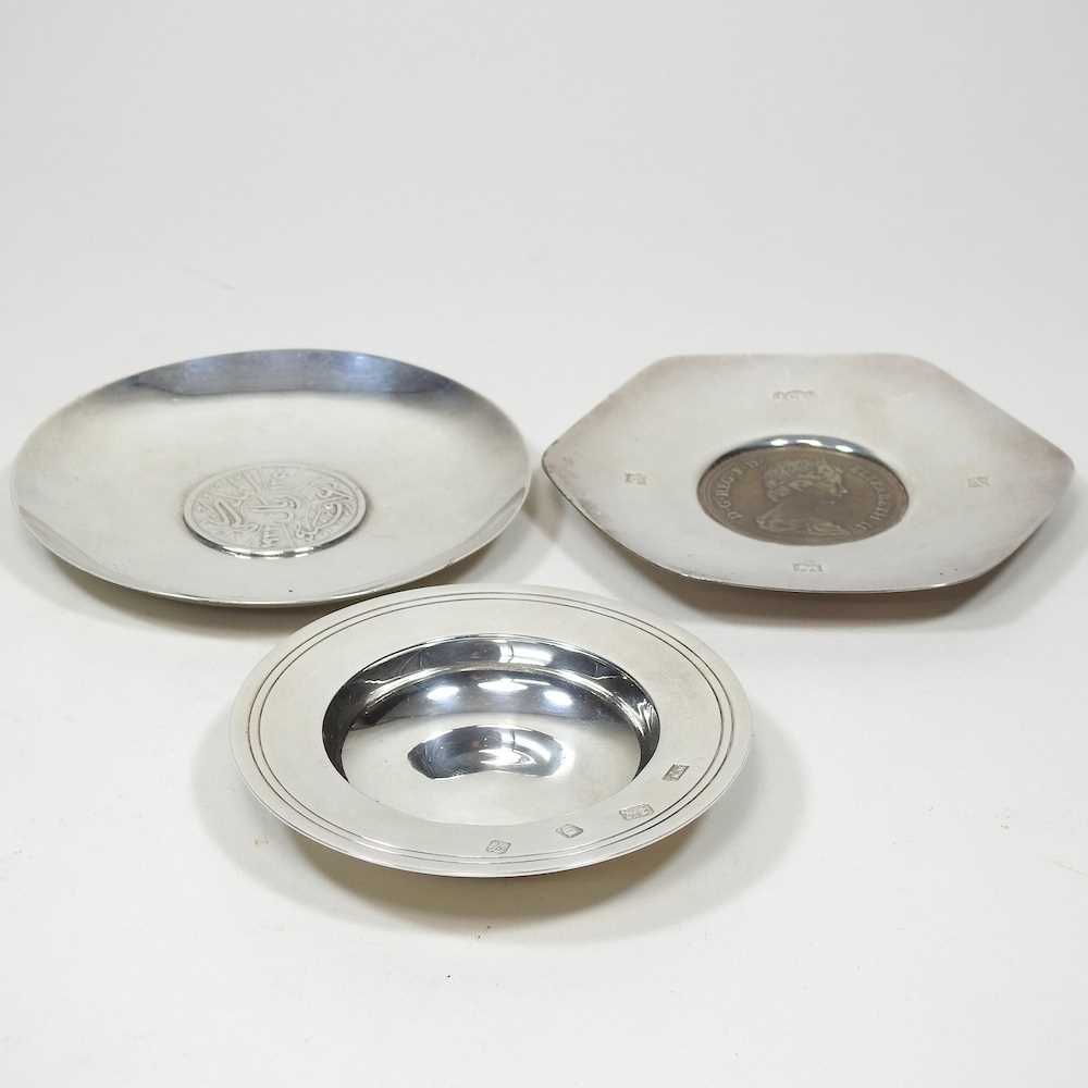 Three silver dishes