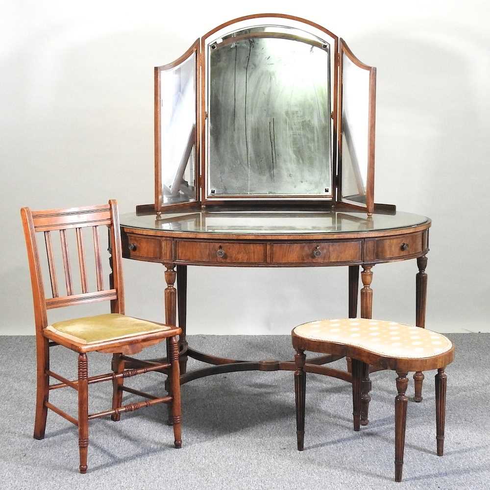 A dressing table, stool and chair