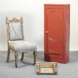 A chair, mirror and cabinet