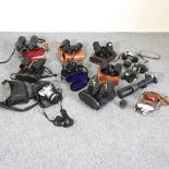 A collection of binoculars and cameras