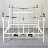 A white painted metal bedstead