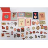 Selection of East German Badges various badges including Shooting ... Kampf Sports ... Athletics.