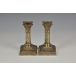 *** WITHDRAWN *** A pair of Edwardian silver dwarf Corinthian column candlesticks Goldsmiths &