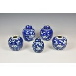 Four Chinese porcelain blue & white ginger jars 20th century, painted with prunus blossom, dentil