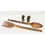 Large African carved wooden spoon and fork measuring 40 3/8in. (102.5cm.) long, together with a