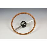 A vintage / classic Lancia Fulvia wood rimmed steering wheel.