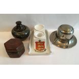 A collection of vintage and antique inkwells
