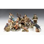 A collection of Capodimonte figurines etc.comprising Tramp with squirrel; Mother Love; Artist tramp,