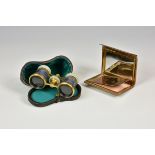 A pair of gilt metal guilloche enamel and mother of pearl opera glasses of typical form,