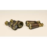 Two pairs of Theatre Field Marine glasses / binoculars, brass leather clad, the larger pair with