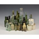 A large collection of vintage / antique bottles of varying sizes and forms, some Guernsey.