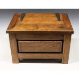 An Arts and Crafts oak box / casket having gothic strap iron brackets to hinged lid, 13 3/8 x 10