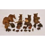 A collection of Black Forest bearsin various poses, to include a skiing bear, the smallest only