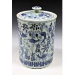 A 20th century Chinese blue & white jar and cover of cylindrical form, decorated with koi amidst