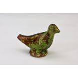 A rare late 18th or early 19th century copper green slipware bird whistle of typical naive form,