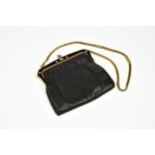 An Oroton of West Germany mesh evening bag, the black mesh body held in place with a gilt metal