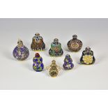 A collection of eight modern enamel decorated Chinese snuff bottles of varying sizes, dates and