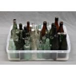 A collection of antique / vintage Guernsey related glass bottles etc.