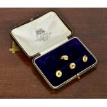 A cased set of 9ct yellow gold studs - 3.7g (incomplete)