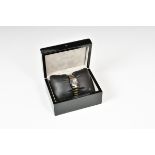 A boxed Wittnauer black and gold tone ladies stainless steel and ceramic watch.