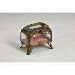 A Victorian gilt metal and bevelled glass jewellery casket of rounded rectangular form,