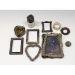 A collection of scrap silver to include photo frames of varying forms, perfume jars, etc,