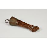 A carved hardwood and copper Figa good luck charm probably mid-20th century, fashioned as an arm