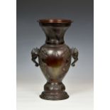 A Chinese patinated bronze two handled vaseprobably 19th century, deep red brown patination,